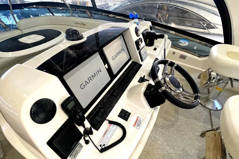  Yacht Photos Pics 2009 Sea Ray Sedan Bridge helm with Garmin navigation displays and modern controls.