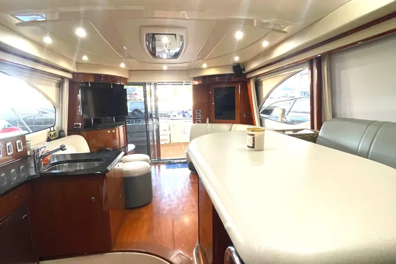  Yacht Photos Pics Luxurious interior of a 2009 Sea Ray Sedan Bridge yacht with modern amenities.