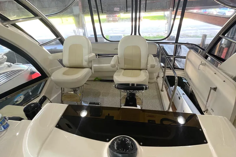 Yacht Photos Pics 2009 Sea Ray Sedan Bridge interior with helm and seating area.