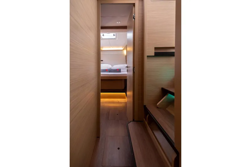  Yacht Photos Pics 2024 Lagoon 450 F interior cabin with modern wood finish and ambient lighting.