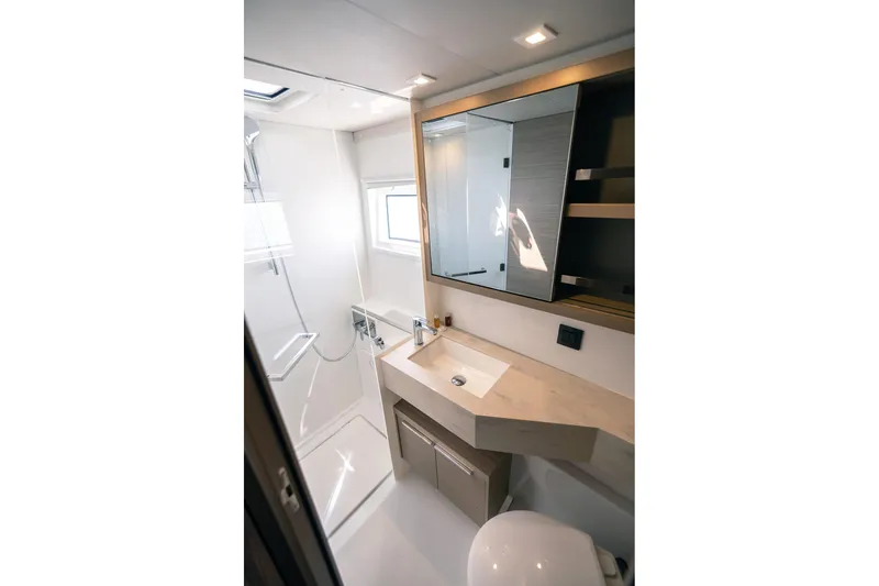  Yacht Photos Pics Modern bathroom interior of 2024 Lagoon 450 F yacht, featuring sleek design and fixtures.