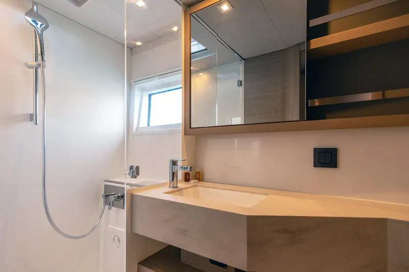  Yacht Photos Pics Modern bathroom interior of 2024 Lagoon 450 F yacht, featuring sleek design and fixtures.