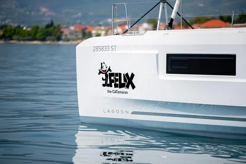  Yacht Photos Pics 2024 Lagoon 450 F catamaran with "Felix the CATamaran" logo on the hull.