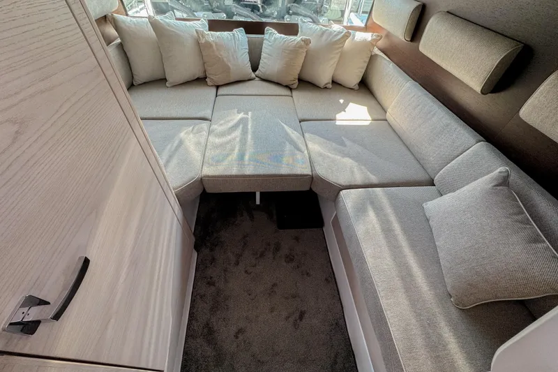  Yacht Photos Pics Luxurious interior of 2024 Axopar 45 XC Cross Cabin with plush seating and cushions.