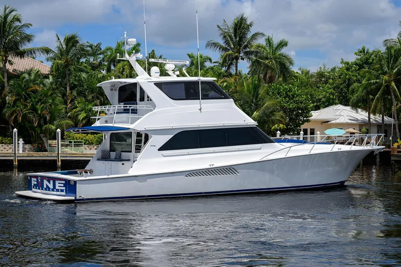 Fine Expierence Yacht Photos Pics 2001 Viking 65 Enclosed Bridge yacht cruising on a tropical waterway.