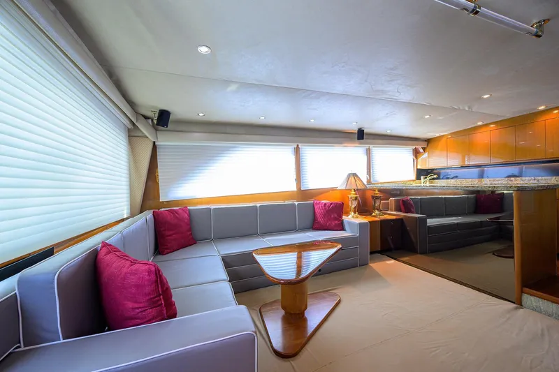 Fine Expierence Yacht Photos Pics Luxurious interior of 2001 Viking 65 Enclosed Bridge yacht with modern seating and decor.