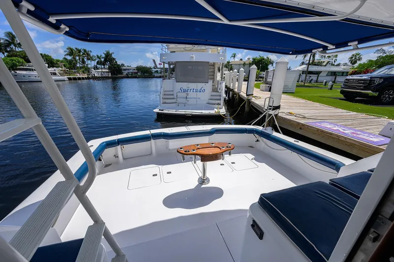 Fine Expierence Yacht Photos Pics 2001 Viking 65 Enclosed Bridge yacht docked, featuring spacious deck and seating area.