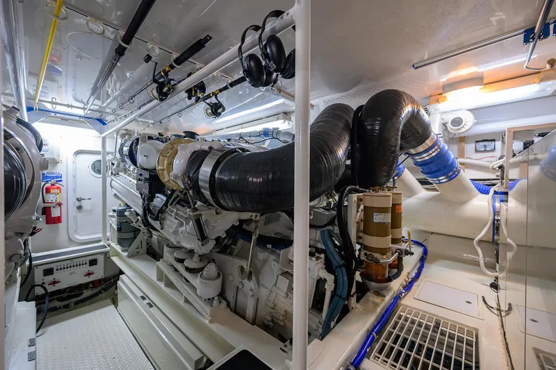 Fine Expierence Yacht Photos Pics Engine room of 2001 Viking 65 Enclosed Bridge yacht, showcasing machinery and equipment.