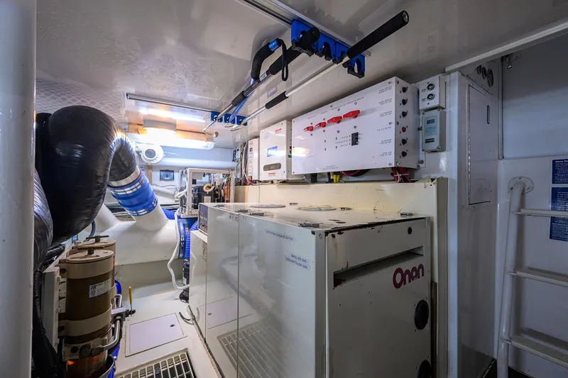 Fine Expierence Yacht Photos Pics Engine room of 2001 Viking 65 Enclosed Bridge yacht with Onan generator and control panels.