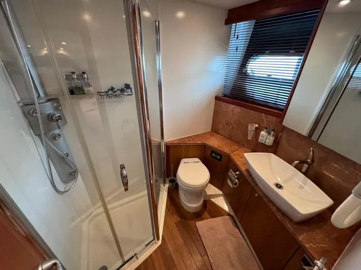  Yacht Photos Pics Luxurious bathroom in 2008 Sunseeker Manhattan 70 yacht with shower, sink, and toilet.