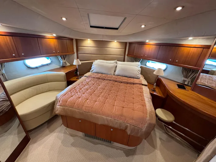  Yacht Photos Pics Luxurious bedroom interior of 2008 Sunseeker Manhattan 70 yacht with elegant wood finishes.