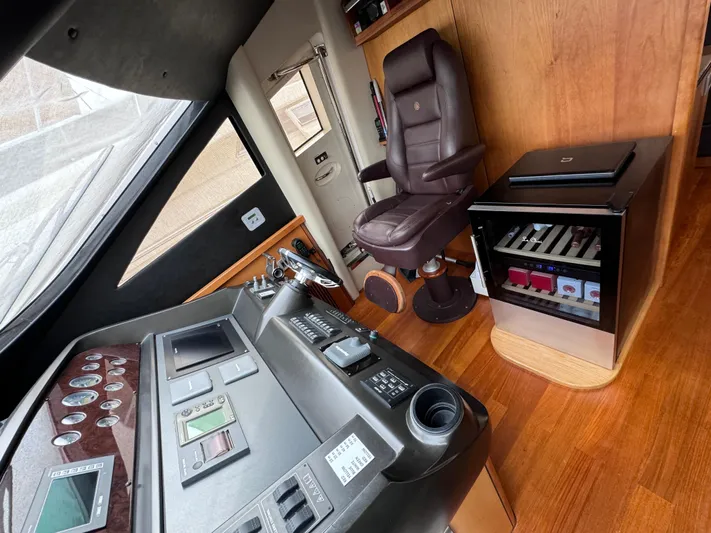  Yacht Photos Pics Control room of 2008 Sunseeker Manhattan 70 yacht with leather chair and navigation equipment.