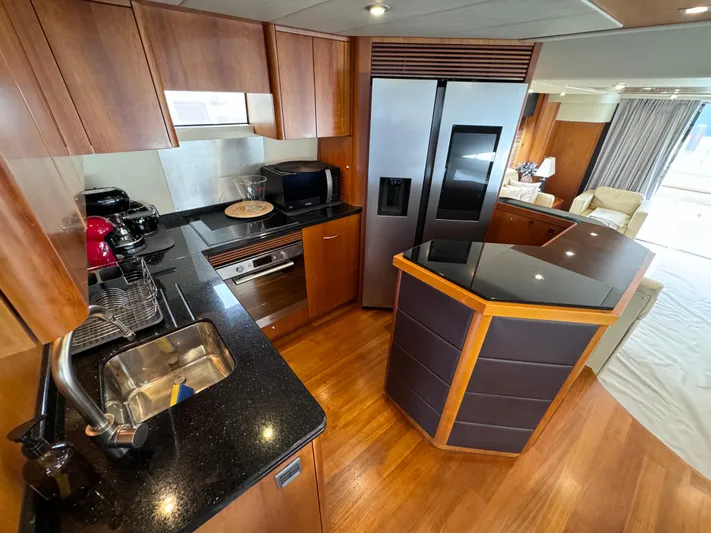  Yacht Photos Pics Luxurious kitchen interior of 2008 Sunseeker Manhattan 70 yacht with modern appliances.