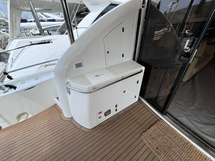  Yacht Photos Pics Sunseeker Manhattan 70 yacht deck with sleek cabinetry, 2008 model.