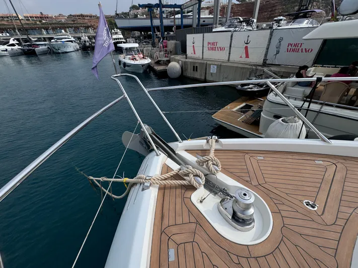  Yacht Photos Pics Bow of 2008 Sunseeker Manhattan 70 yacht docked at marina, featuring teak decking.