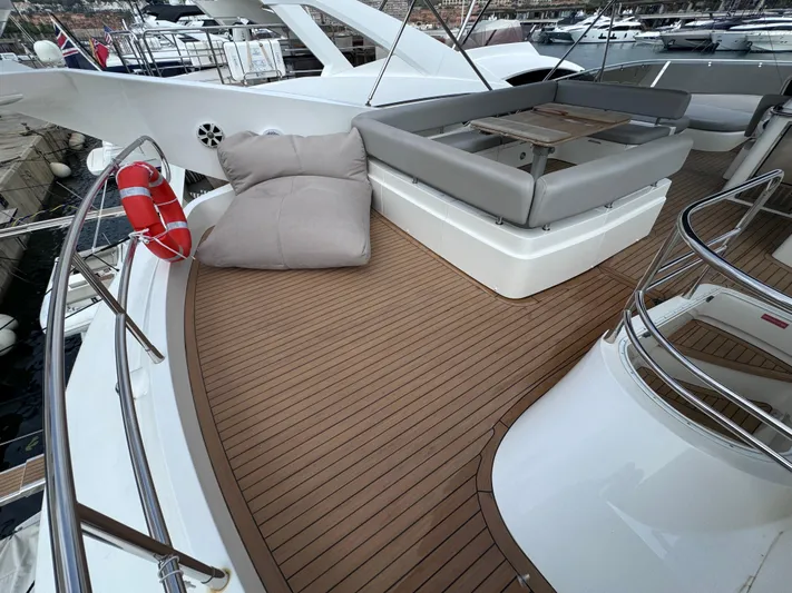  Yacht Photos Pics Luxurious 2008 Sunseeker Manhattan 70 yacht deck with seating and life preserver.