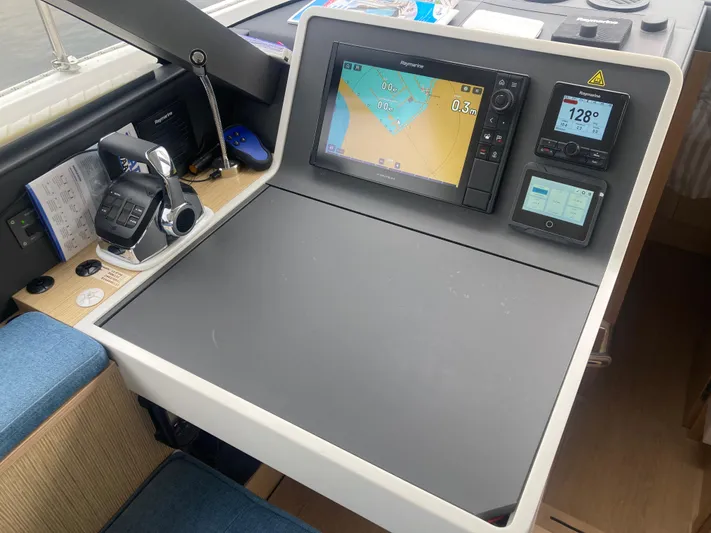  Yacht Photos Pics Navigation station of 2022 Moody Decksaloon 41 with modern controls and display.