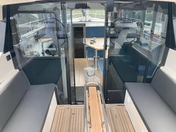  Yacht Photos Pics 2022 Moody Decksaloon 41 interior with modern seating and navigation area.