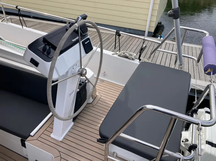  Yacht Photos Pics Cockpit of 2022 Moody Decksaloon 41 yacht with steering wheel and seating.