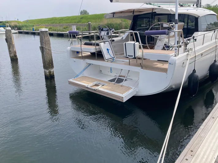  Yacht Photos Pics 2022 Moody Decksaloon 41 yacht docked at marina, rear view with open swim platform.