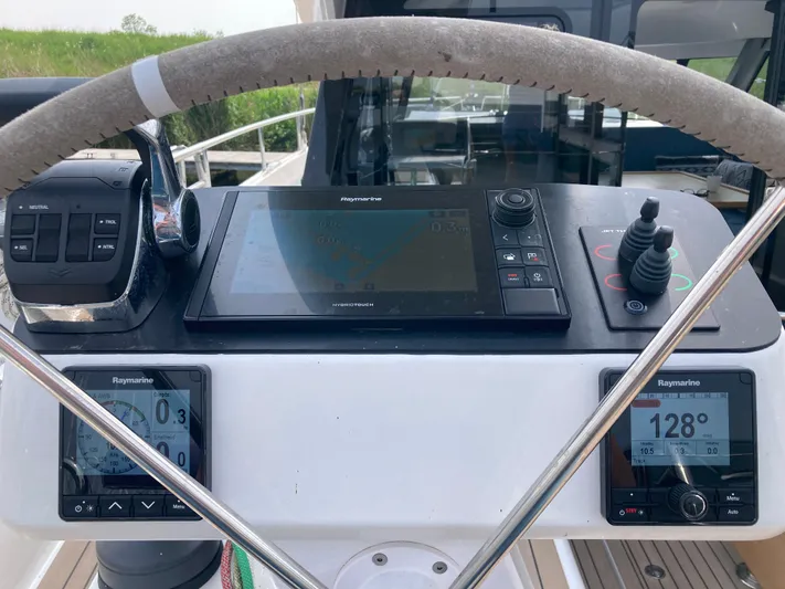  Yacht Photos Pics Cockpit of 2022 Moody Decksaloon 41 with navigation instruments and steering wheel.
