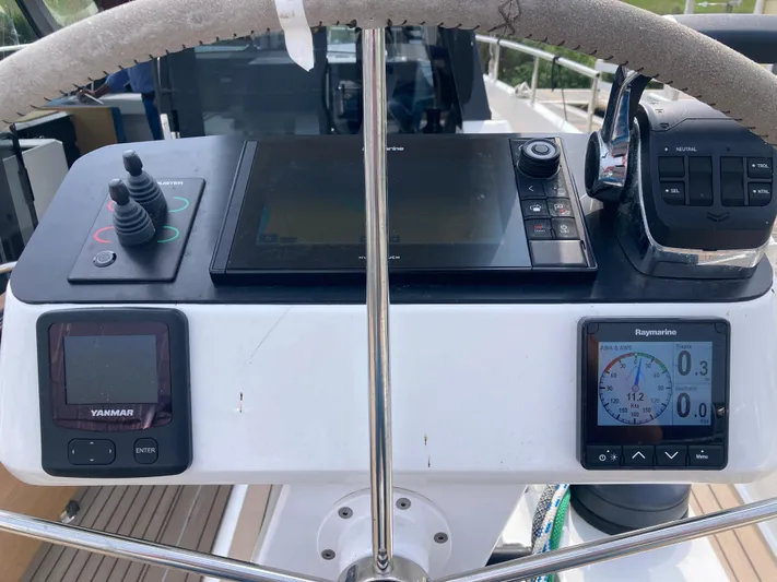  Yacht Photos Pics Steering console of 2022 Moody Decksaloon 41 yacht with navigation instruments and controls.