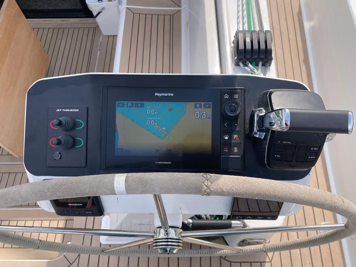  Yacht Photos Pics Steering console of 2022 Moody Decksaloon 41 with navigation display and controls.