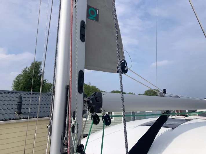  Yacht Photos Pics Sailboat mast and rigging on a 2022 Moody Decksaloon 41 under a cloudy sky.