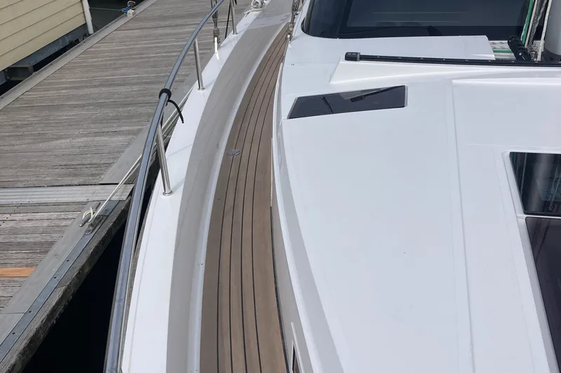  Yacht Photos Pics Sleek 2022 Moody Decksaloon 41 yacht docked, showcasing elegant deck design.