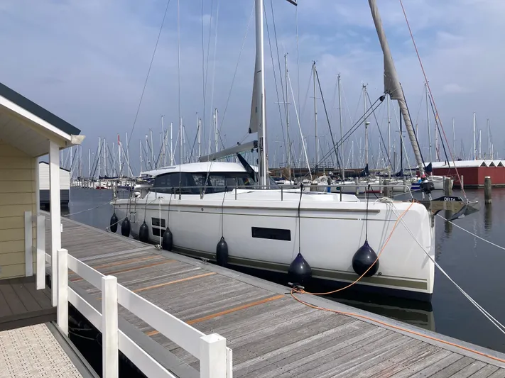  Yacht Photos Pics 2022 Moody Decksaloon 41 yacht docked at marina with sailboats in background.