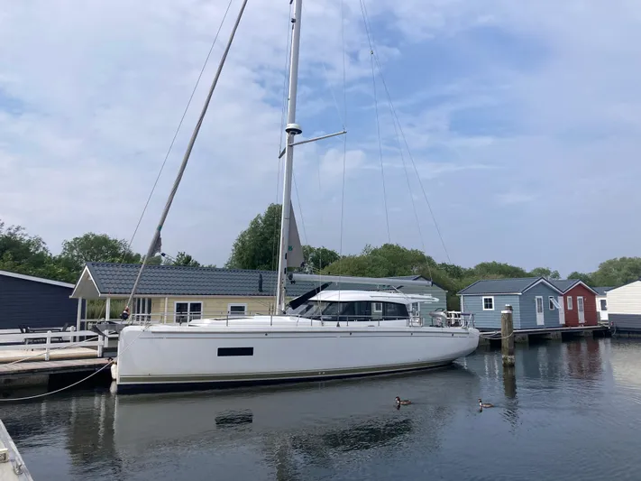  Yacht Photos Pics 2022 Moody Decksaloon 41 yacht docked near colorful boathouses.