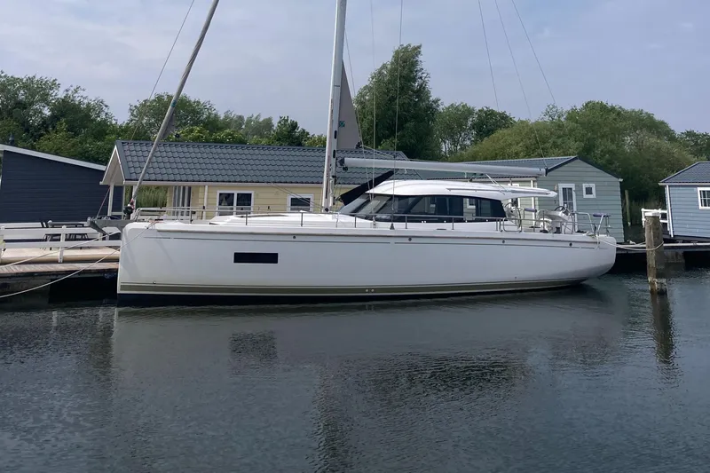  Yacht Photos Pics 2022 Moody Decksaloon 41 yacht docked by waterfront homes.