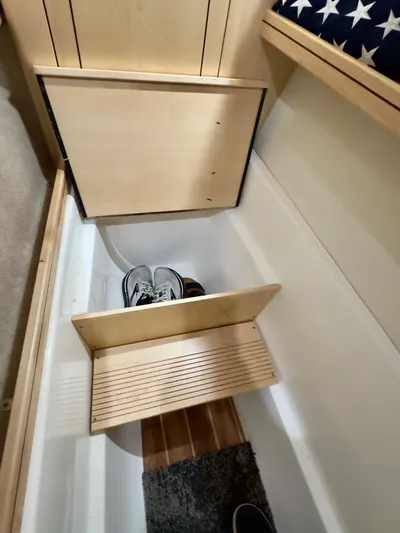  Yacht Photos Pics Built-in storage compartment in Aspen C108, 2026 model, with shoes inside.
