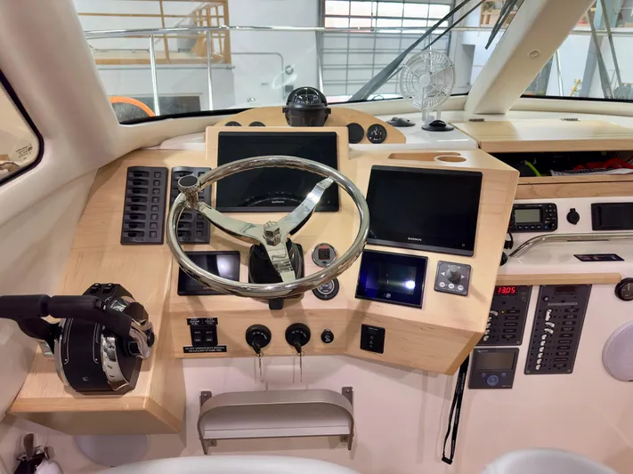  Yacht Photos Pics Helm of 2026 Aspen C108 boat with modern controls and navigation screens.