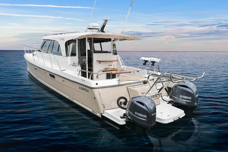  Yacht Photos Pics 2026 Aspen C108 boat with Yamaha engines on calm ocean waters.