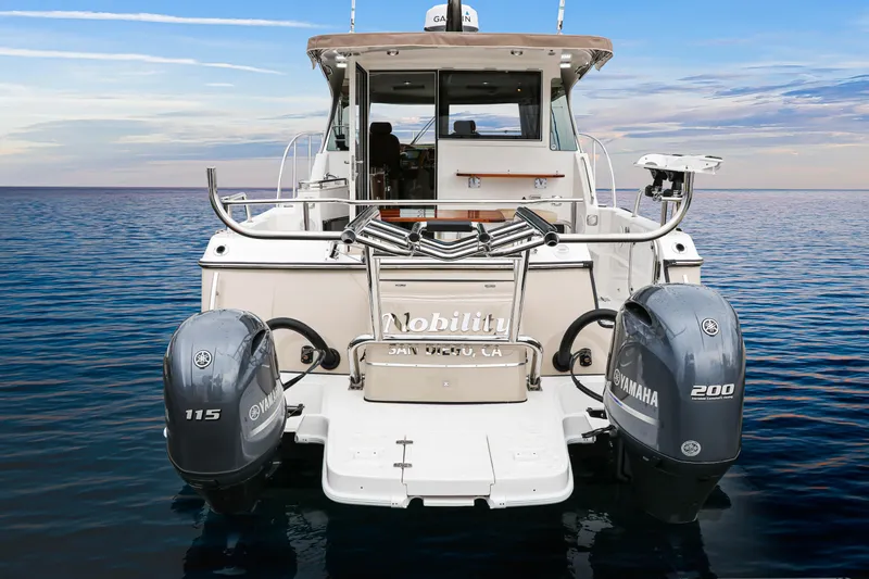  Yacht Photos Pics Aspen C108 2026 boat with dual Yamaha outboard motors on calm ocean water.