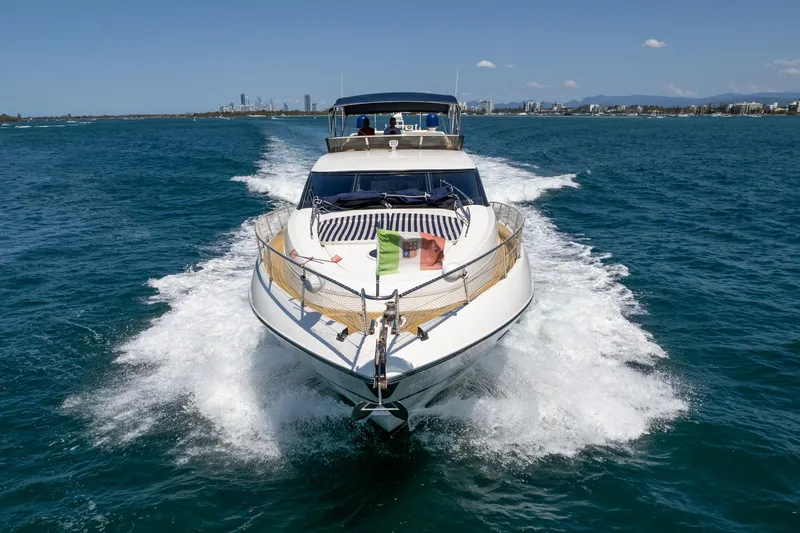 Shhmic Yacht Photos Pics Sunseeker Manhattan 74 yacht cruising on open water, 2001 model.