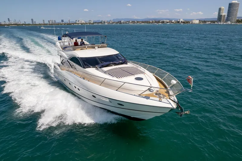Shhmic Yacht Photos Pics Sunseeker Manhattan 74 yacht cruising on open water, 2001 model.