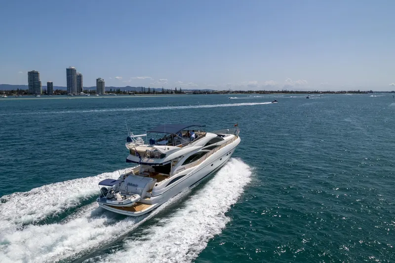 Shhmic Yacht Photos Pics Sunseeker Manhattan 74 yacht cruising on open water, 2001 model.