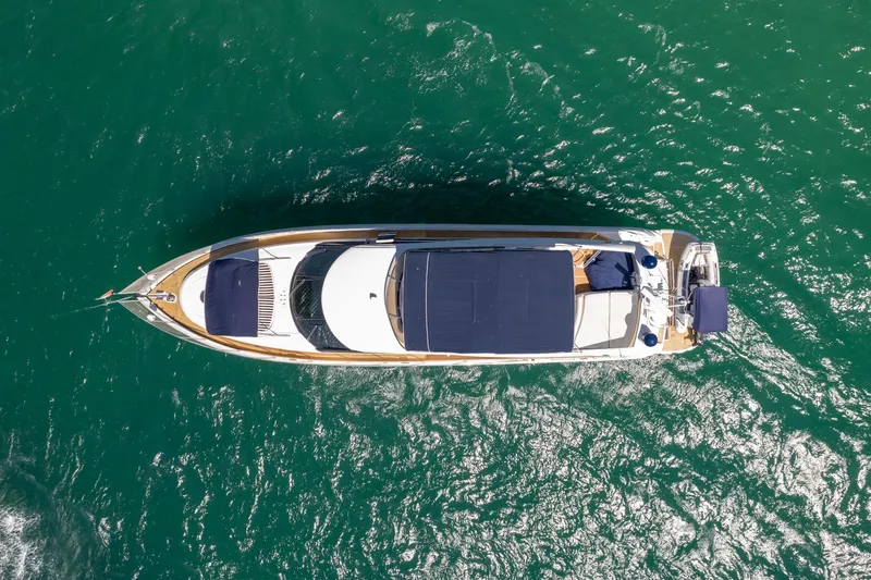 Shhmic Yacht Photos Pics Aerial view of 2001 Sunseeker Manhattan 74 yacht on green water.