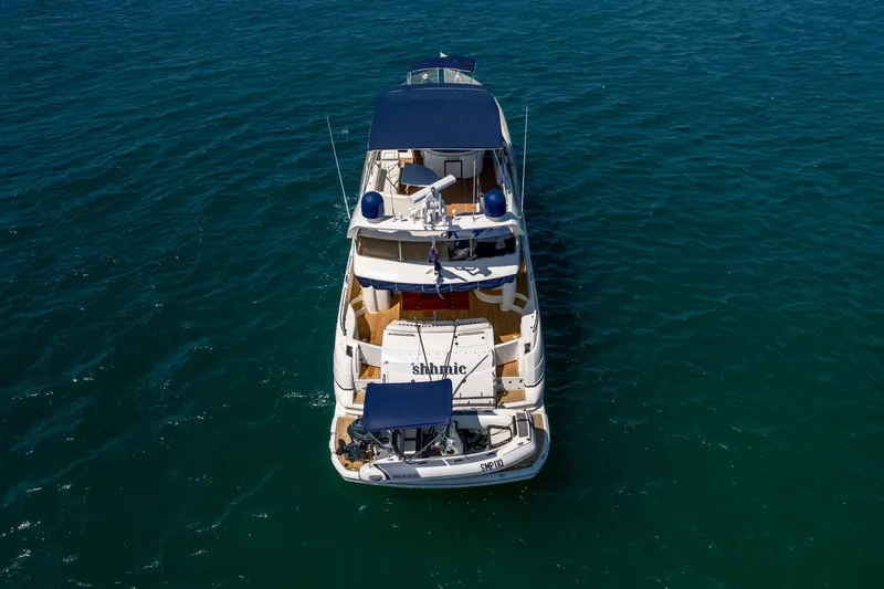 Shhmic Yacht Photos Pics Sunseeker Manhattan 74 yacht from 2001 on open water, aerial view.