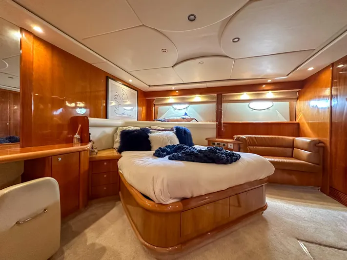 Shhmic Yacht Photos Pics Luxurious cabin interior of 2001 Sunseeker Manhattan 74 yacht with elegant wood finishes.