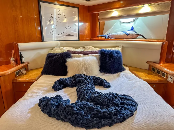 Shhmic Yacht Photos Pics Luxurious bedroom interior of 2001 Sunseeker Manhattan 74 yacht with plush bedding and decor.