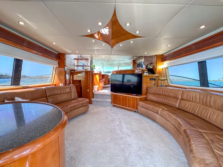 Shhmic Yacht Photos Pics Luxurious interior of 2001 Sunseeker Manhattan 74 yacht with leather seating and modern amenities.