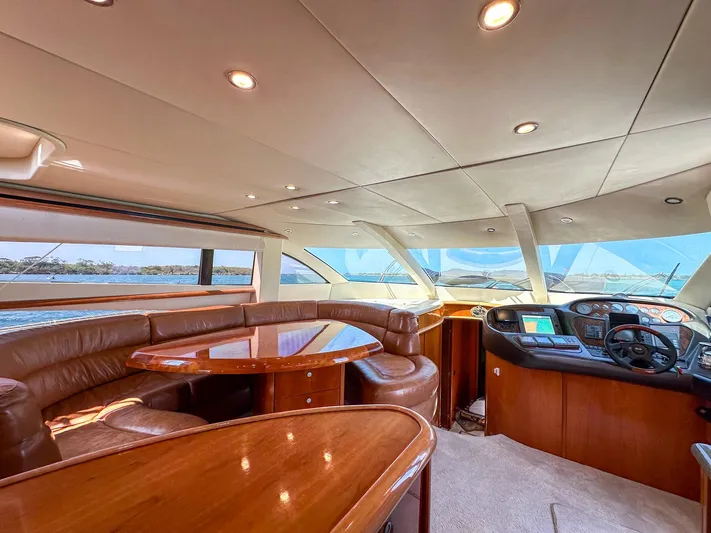 Shhmic Yacht Photos Pics Luxurious interior of 2001 Sunseeker Manhattan 74 yacht with leather seating and modern helm.