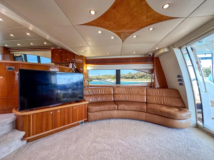 Shhmic Yacht Photos Pics Luxurious interior of 2001 Sunseeker Manhattan 74 yacht with leather seating and large TV.