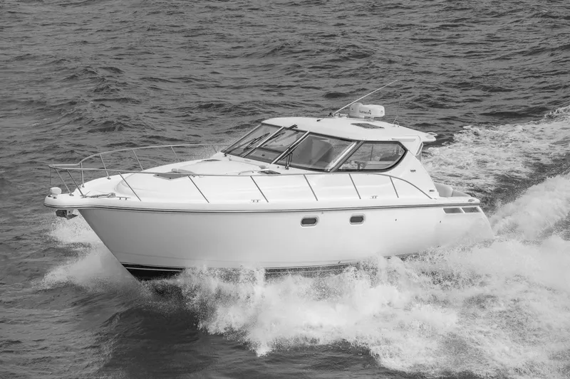  Yacht Photos Pics 2007 Tiara Yachts 4300 Sovran cruising on open water, showcasing sleek design and performance.