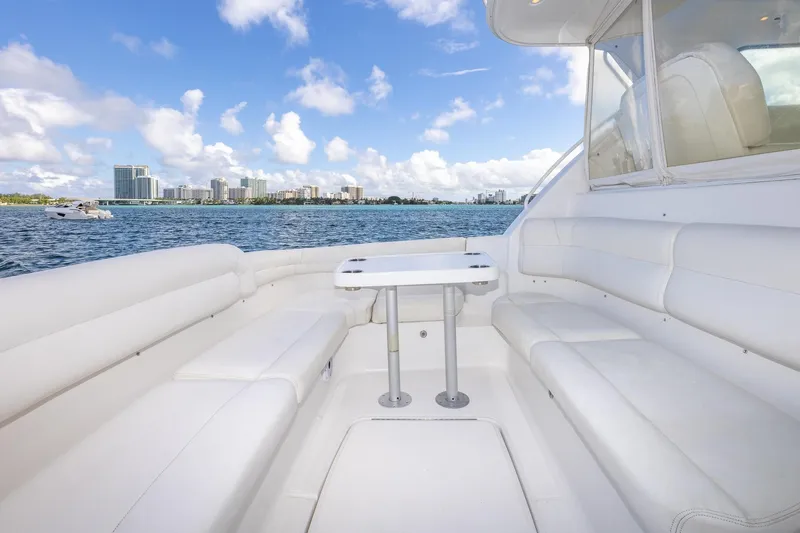  Yacht Photos Pics Luxurious 2007 Tiara Yachts 4300 Sovran with white seating, ocean view, and city skyline.