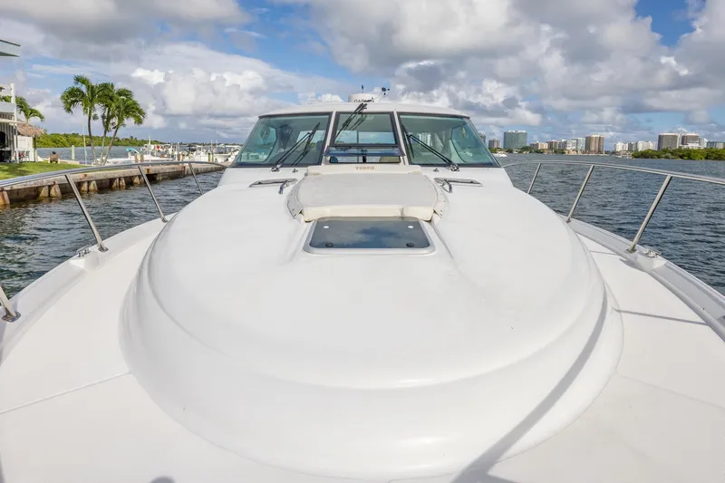  Yacht Photos Pics 2007 Tiara Yachts 4300 Sovran on water, showcasing sleek deck design and city skyline.