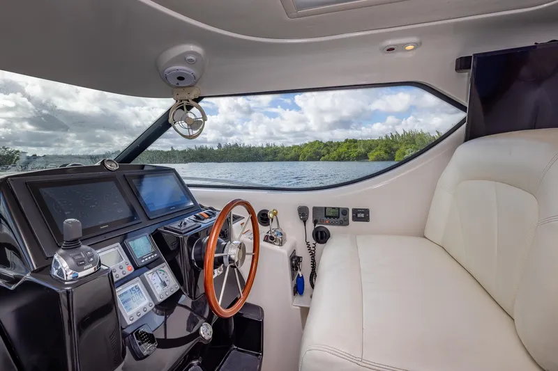  Yacht Photos Pics 2007 Tiara Yachts 4300 Sovran helm with modern controls and scenic water view.